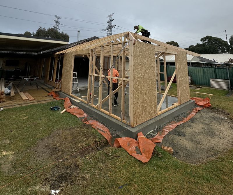 Timber wall and roof framing standing on a new slab